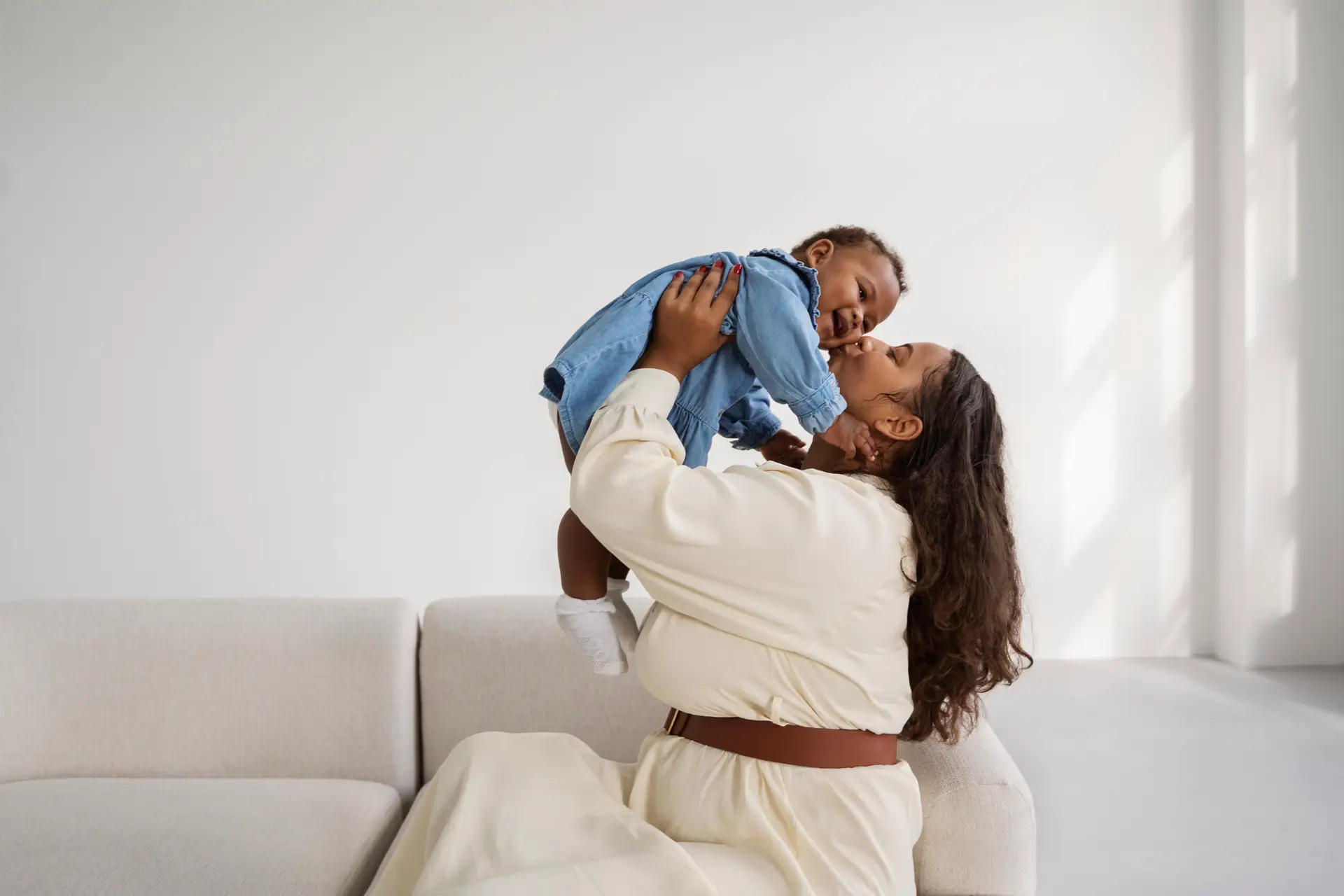black mother taking car her child